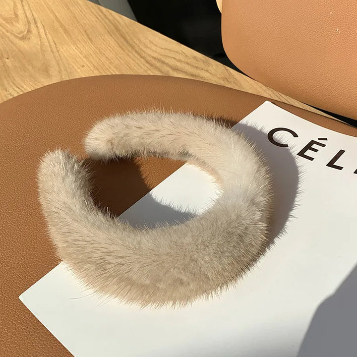 Warm women's faux fur headband, elegant winter accessory, perfect for cold weather fashion & warmth.