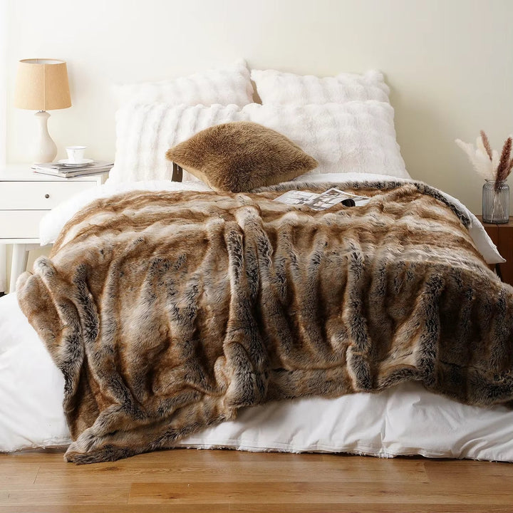Machine washable faux fur throw blanket, a soft, warm & stylish decorative accent for modern homes.