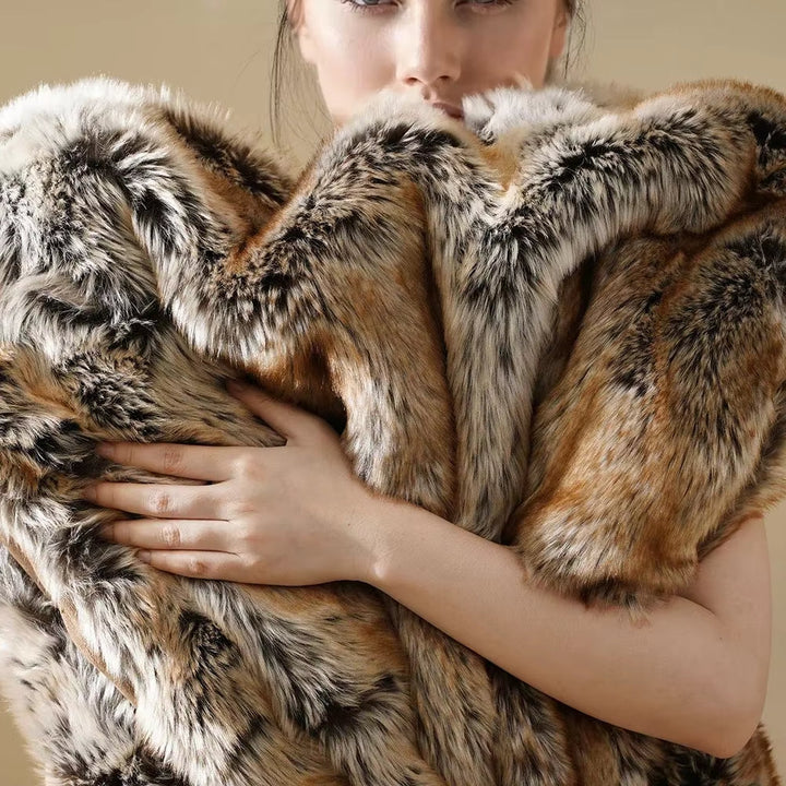 Plush faux fur throw blanket, a warm & cozy soft blanket for living room or bedroom home decor.