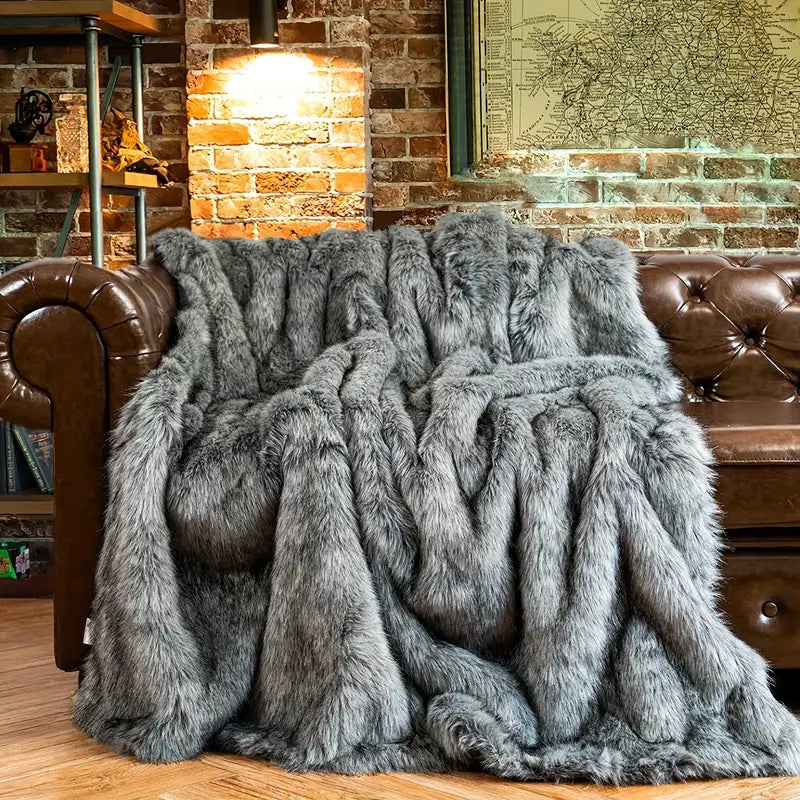 Realistic faux fur throw blanket, a luxury, soft & warm home decor accent for a cozy ambiance.