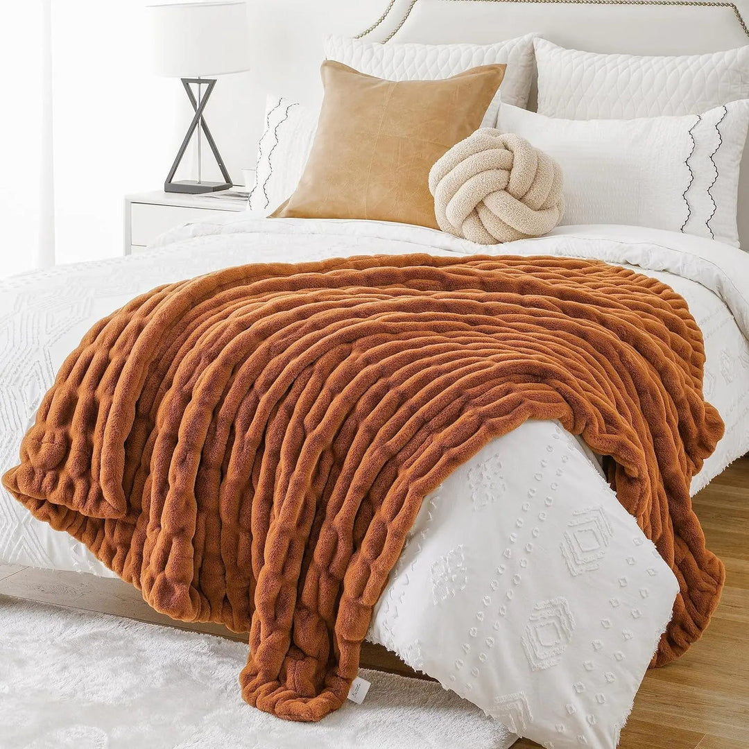 Elegant throw blanket, luxurious faux fur for a plush and cozy living room.