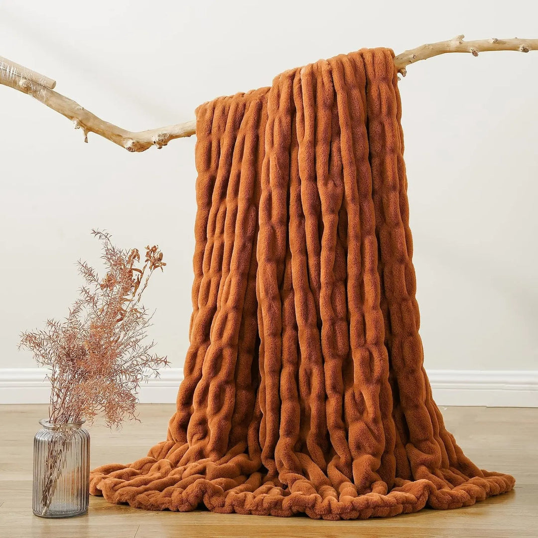 Soft faux fur throw blanket, a plush and comfortable addition to your home decor.