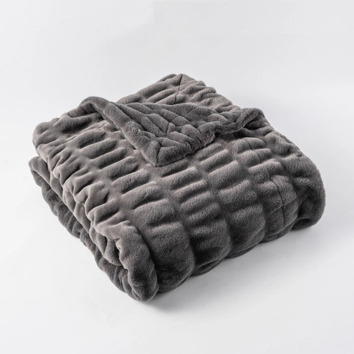 Plush faux fur throw, an elegant and soft blanket for luxurious home decor.