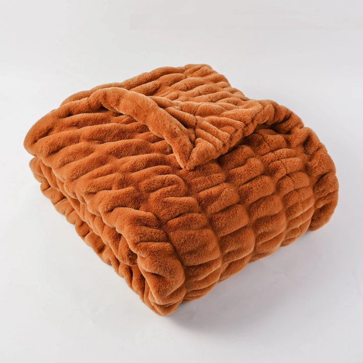 Luxurious soft faux fur throw blanket, enhancing your home with cozy, elegant style.