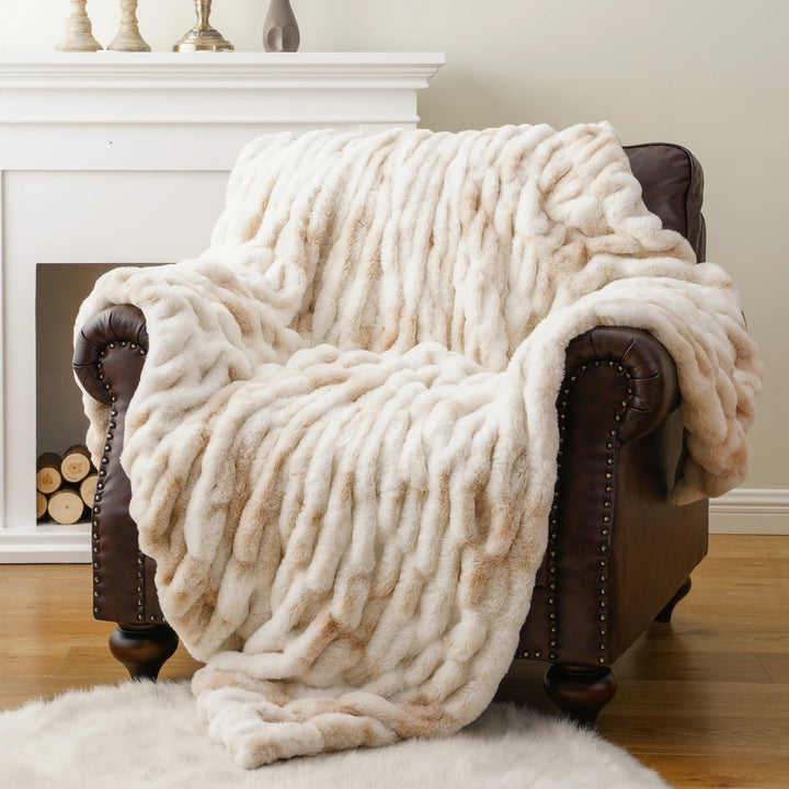 Cozy faux fur throw blanket, perfect for adding warmth and style to any living room.