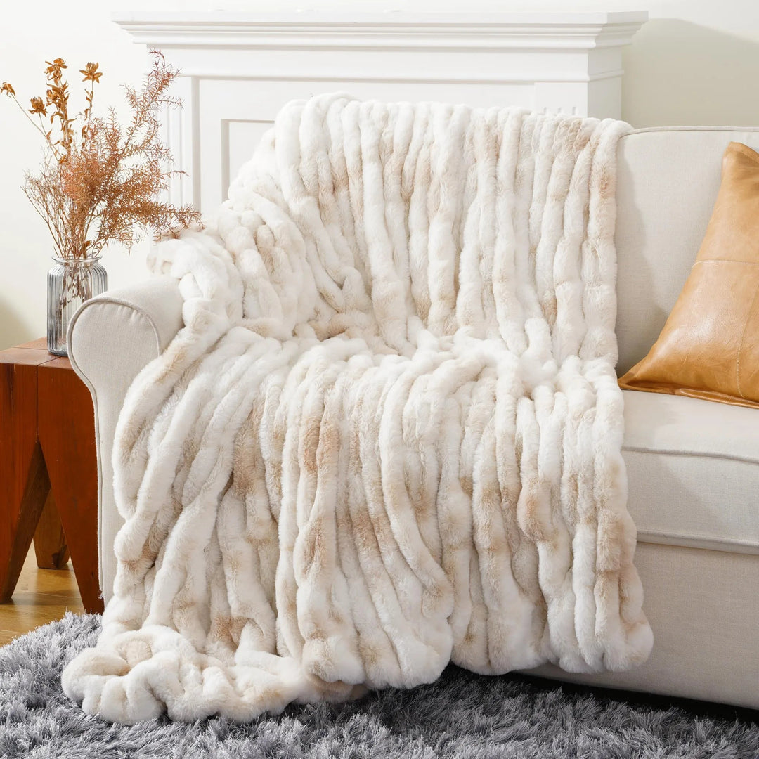 Elegant faux fur throw blanket, bringing luxurious comfort and warmth to your space.