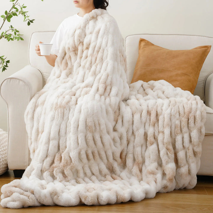 Soft faux fur throw blanket for a cozy living room, enhancing home decor.