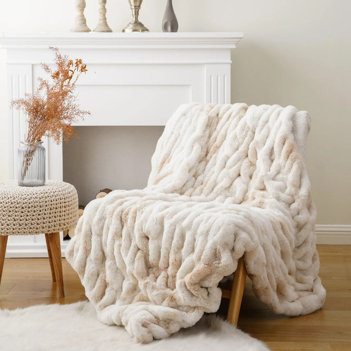 Luxurious and plush faux fur throw, ideal for comfortable and stylish home accents.