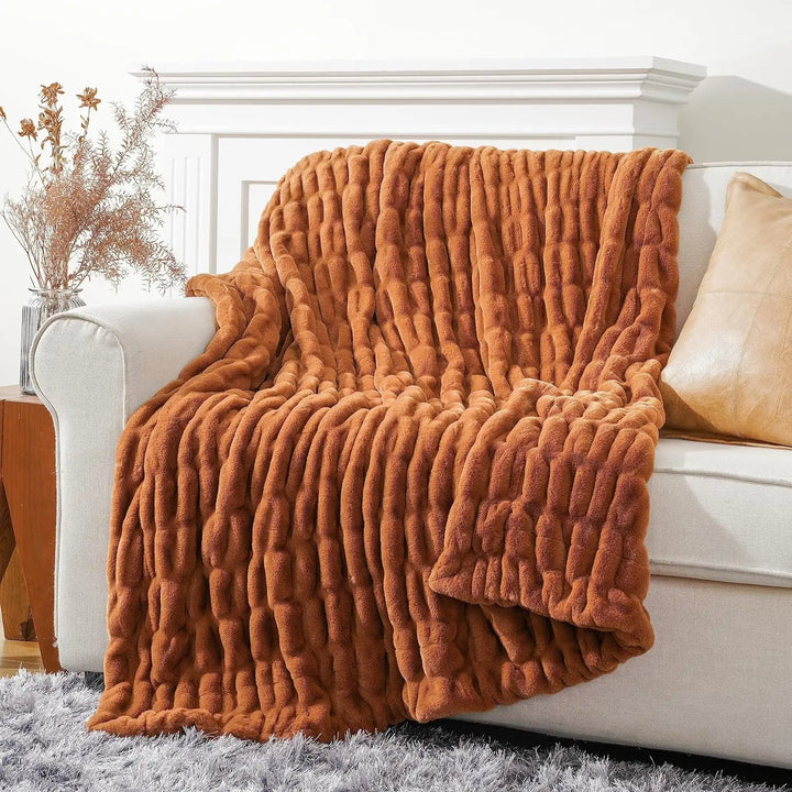 Faux fur throw blanket, plush and cozy, perfect for luxurious home comfort.