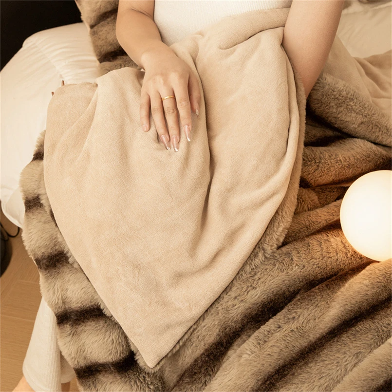 Plush faux rabbit fur blanket for ultimate comfort. A warm, soft throw, perfect for luxury home decor.