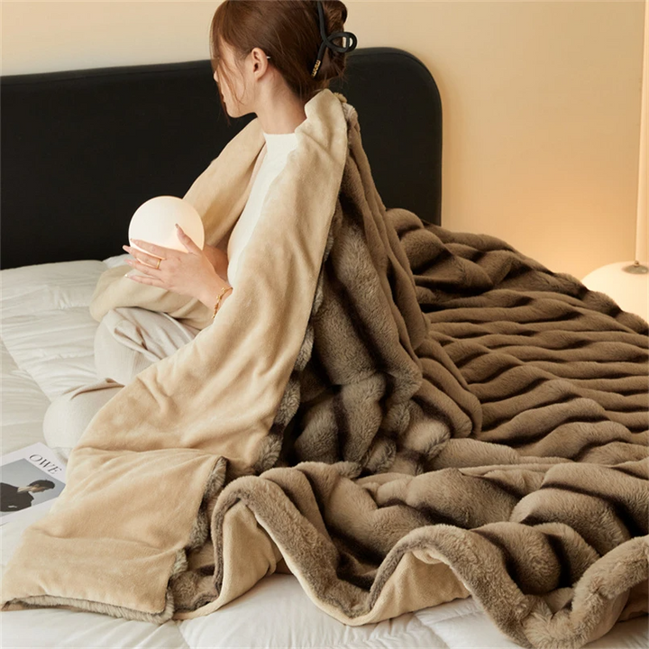 Cozy faux rabbit fur throw, designed for supreme softness and warmth. Great for bedroom essential.
