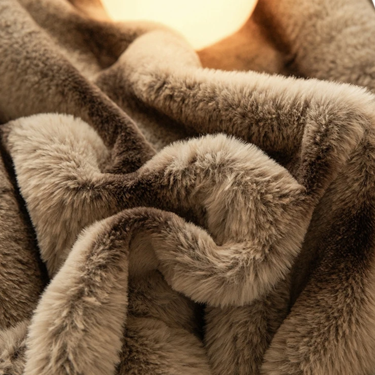Warm decorative faux fur blanket with a luxurious rabbit fur feel. Ideal soft throw for any room.