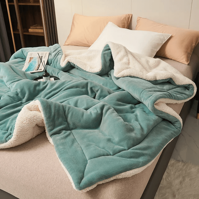 Plush fleece blanket providing exceptional warmth & softness. Ideal for bedroom or living room accents.