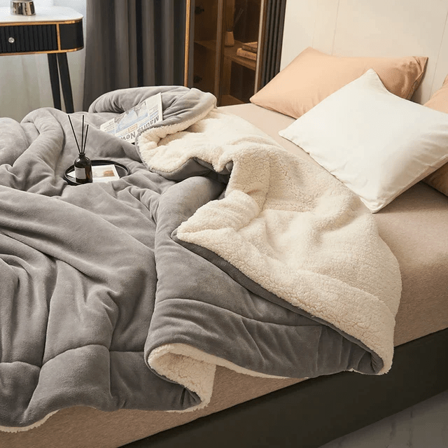 Elegant unisex fleece throw blanket for all seasons. Adds cozy comfort & style to bedroom or living room decor.