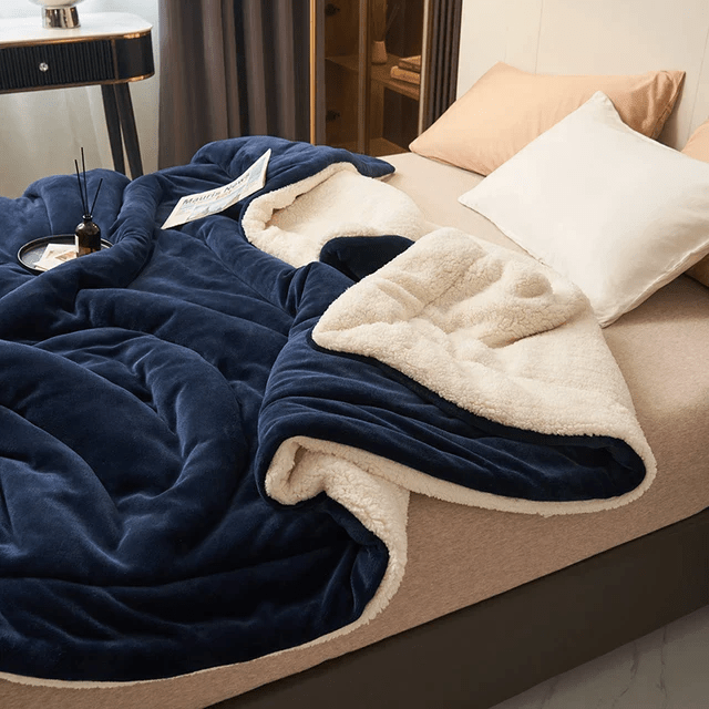 Ultra-soft, cozy fleece blanket with a plush texture, offering ultimate warmth & home comfort. Machine washable.
