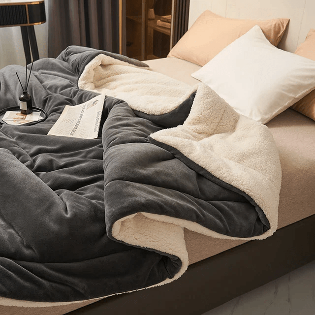 Luxurious unisex fleece blanket, an elegant and warm addition to any bedroom or living room. All-season comfort.