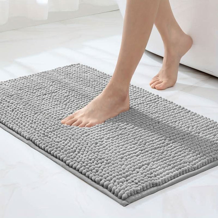 Luxurious plush chenille bath rug, ultra-soft and absorbent for ultimate comfort in any bathroom.