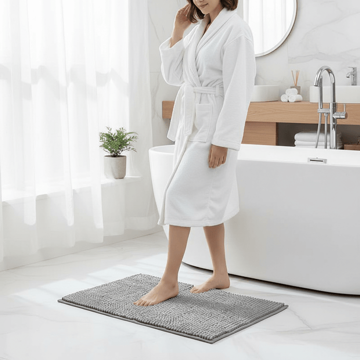 Non-slip chenille bath mat, highly absorbent and quick-drying for bathroom safety and comfort.