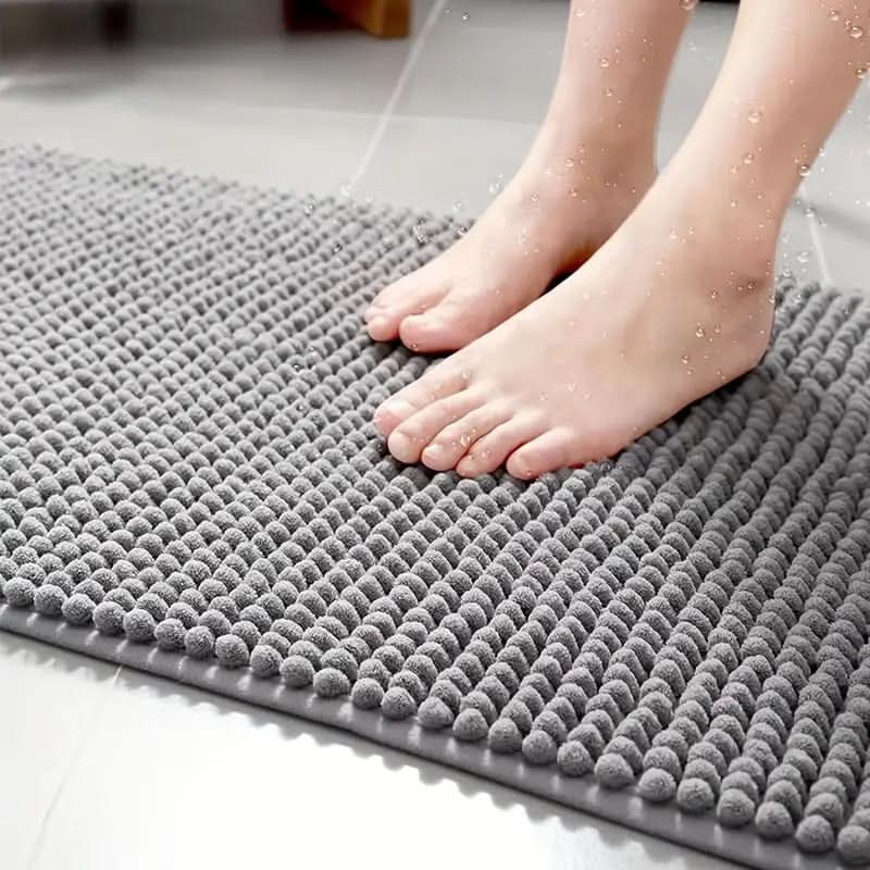 Plush chenille bath mat, ultimate comfort with a non-slip design, a home essential for bathrooms.