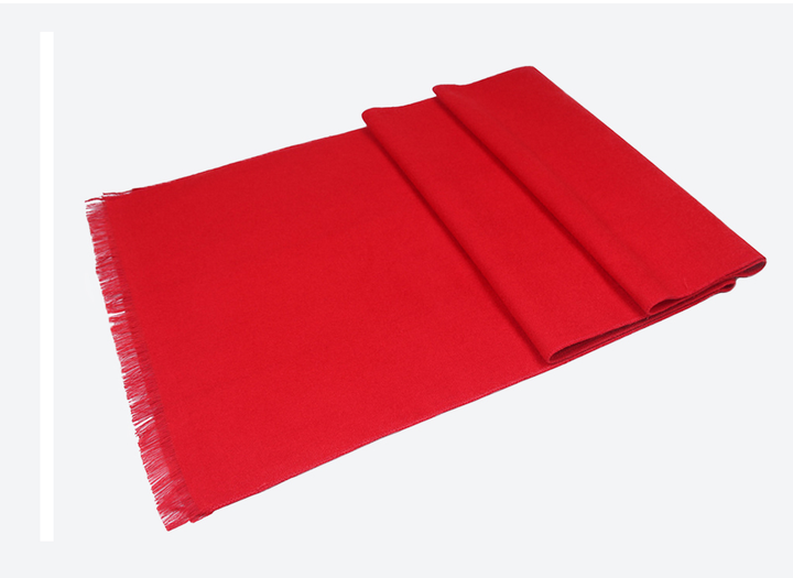 Close-up of a high-quality red cashmere blend scarf, a soft and warm winter essential