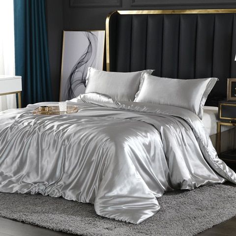 Elegant bedroom decor featuring a 4-piece silk-satin duvet cover set for ultimate comfort