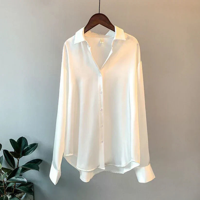 Versatile elegant women's satin blouse. Stylish long-sleeve top, ideal for casual chic outfits or professional office wear.