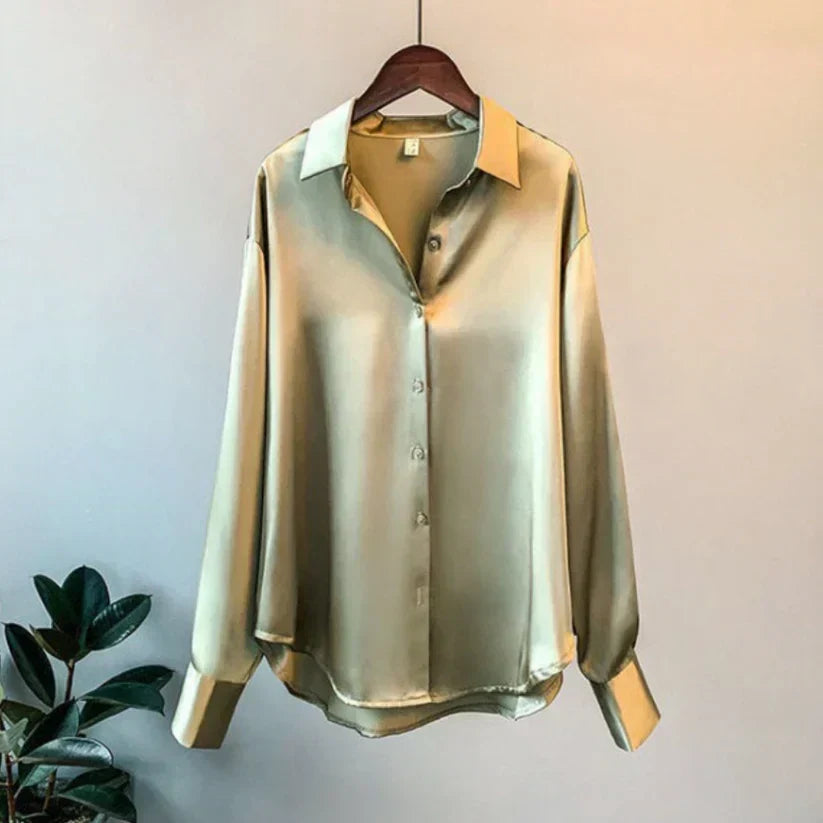 Flowy elegant women's long-sleeve satin blouse with button front. Classy versatile top for fashion-forward women.