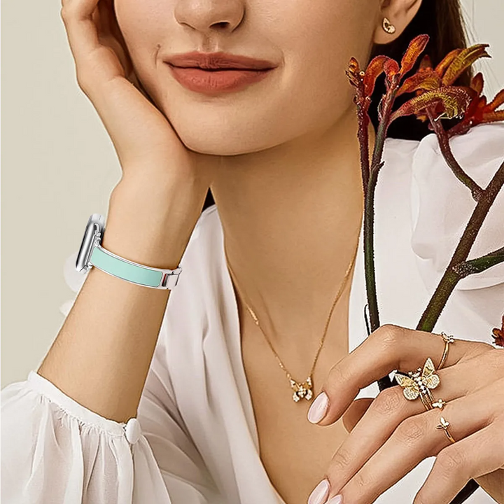 Modern Apple Watch band: unisex design with polished metal and unique enamel sections for a sophisticated tech cuff.