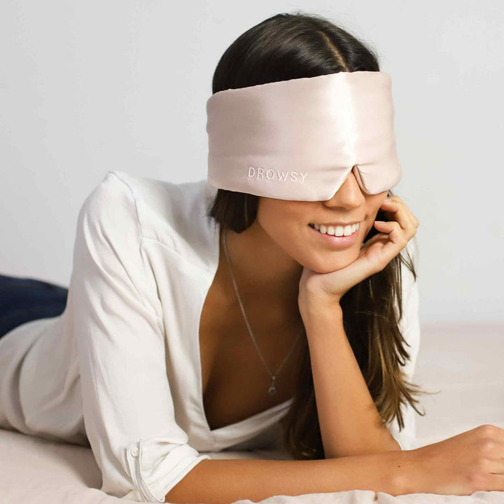 Soft silk eye mask promoting comfortable, deep sleep, blocks light for better rest.