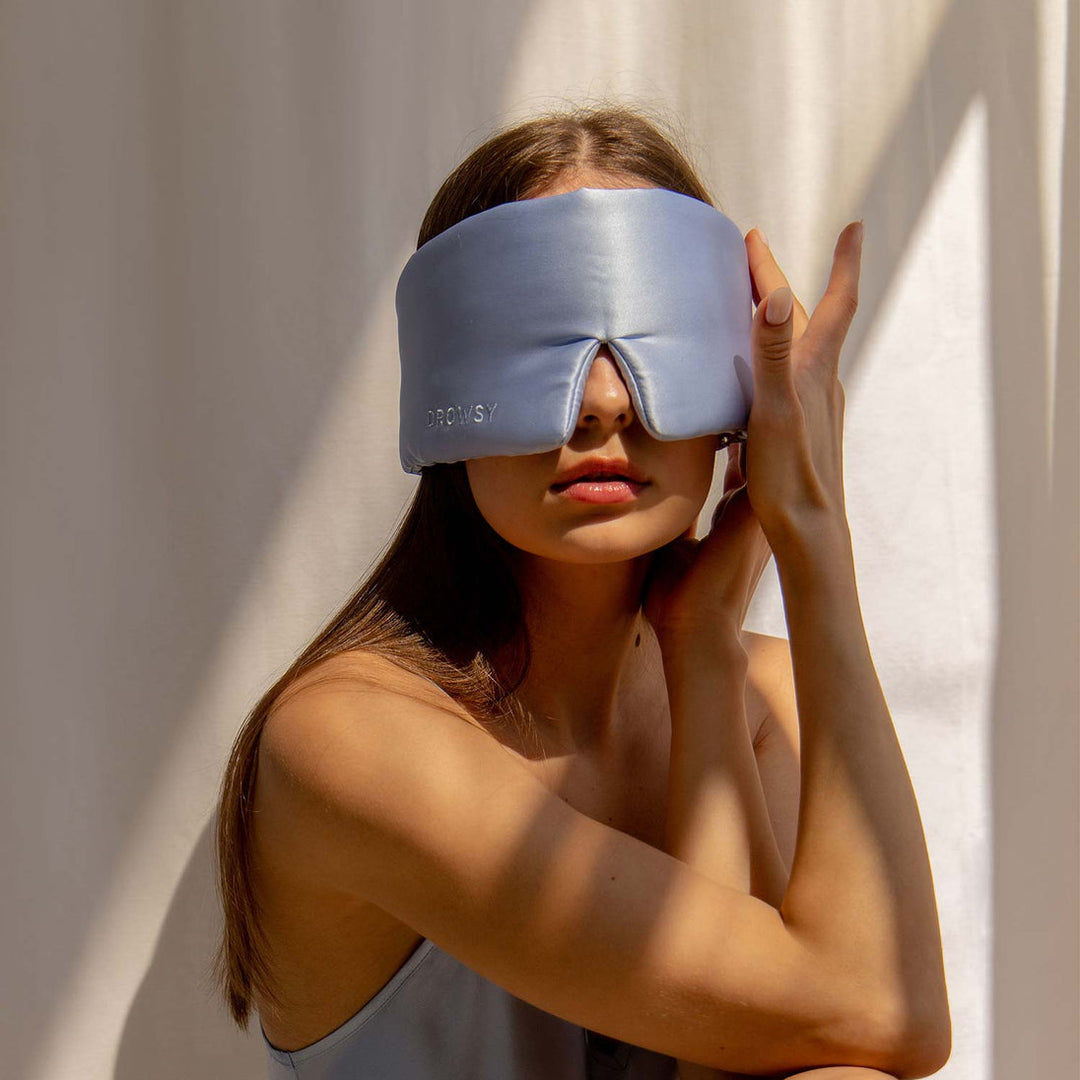 Unisex silk eye mask for complete darkness, enhancing sleep quality and relaxation.