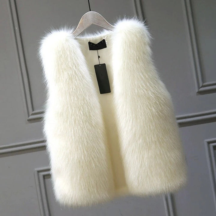 Luxurious women's cozy winter vest, perfect for warm layering. Elegant sleeveless jacket for fall fashion.