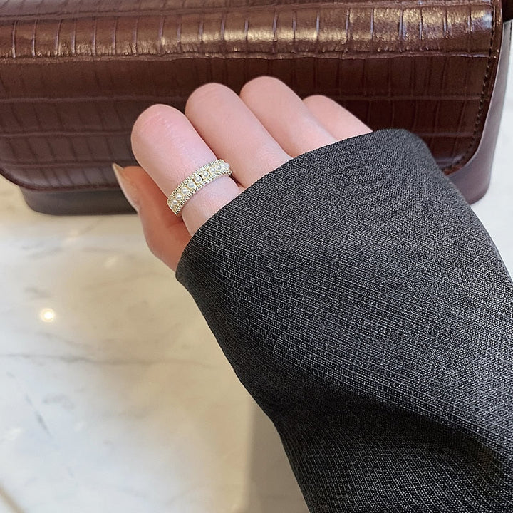Exquisite women's gold ring with a classic pearl setting. High-quality pearl ring, a timeless and luxurious accessory.