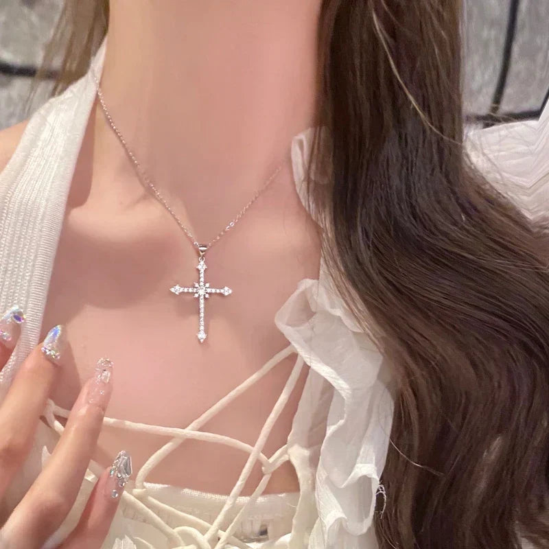 Elegant women's cross pendant necklace, featuring shimmering zircon crystals on a sterling silver chain.