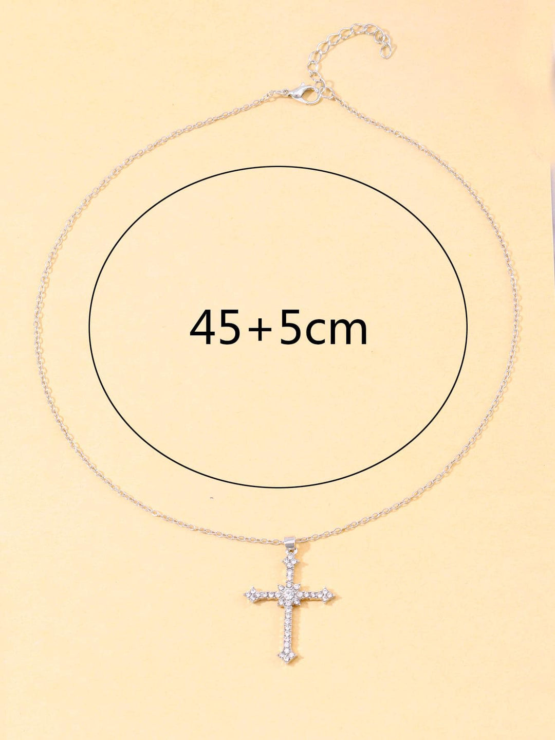 Adjustable women's silver necklace with a brilliant zircon crystal cross pendant. Sparkling elegant religious jewelry.