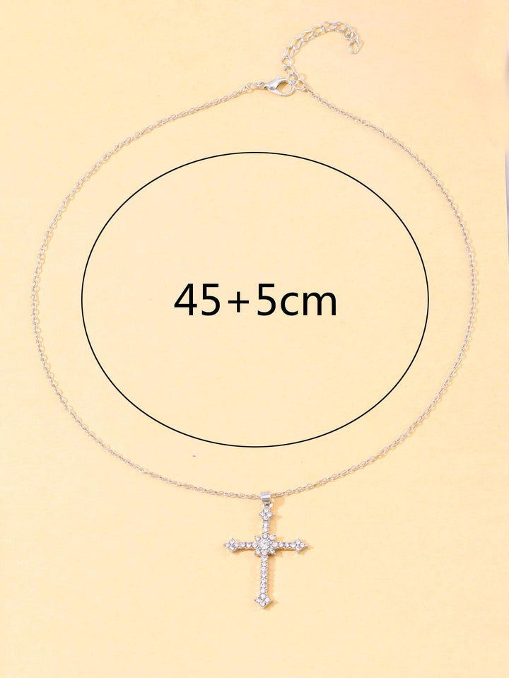 Adjustable women's silver necklace with a brilliant zircon crystal cross pendant. Sparkling elegant religious jewelry.