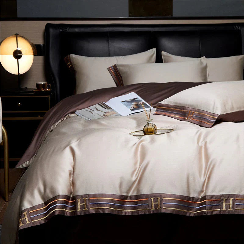 Elegant bedroom styled with a complete 4-piece luxury satin bedding set. Enhances comfort & modern home decor.