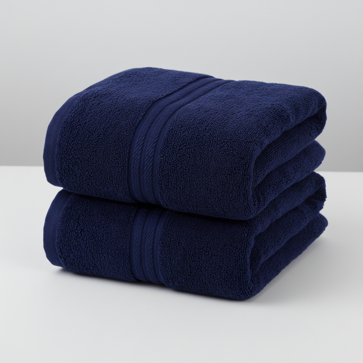 Close-up of a thick, absorbent cotton hand towel, part of a luxury bath set, textured surface