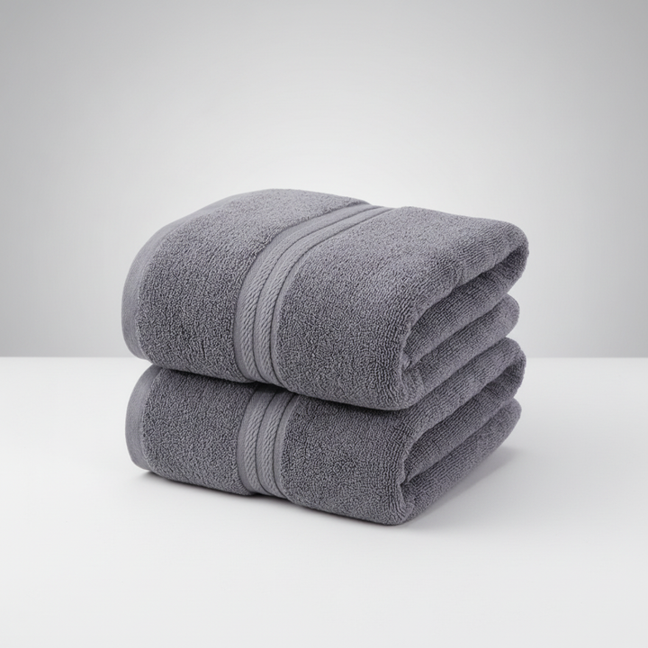High-quality cotton luxury bath towel set, charcoal gray, folded with a decorative ribbon