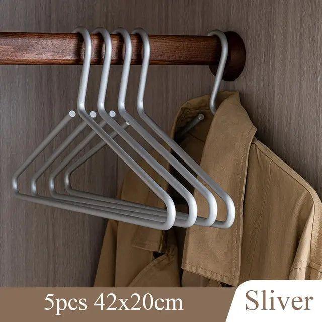 Functional anti-slip metal hangers preventing clothes from falling. Essential for efficient closet storage.