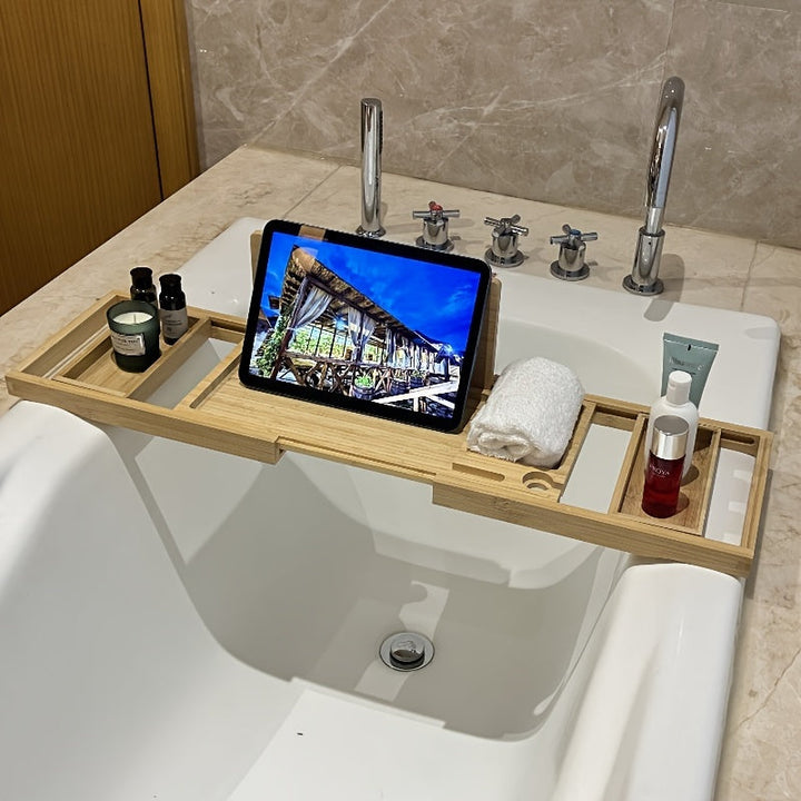 Extendable bamboo bathtub tray, a versatile bath caddy designed for all tub sizes, enhancing relaxation.