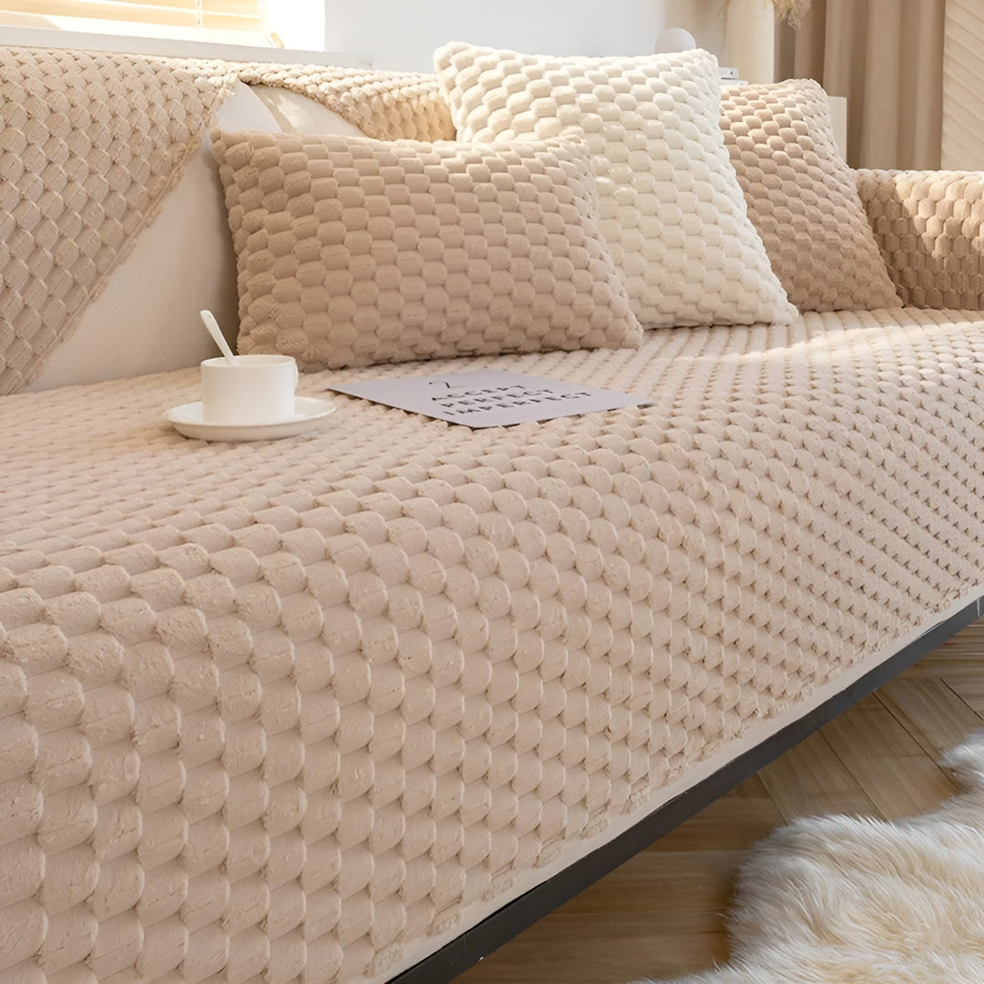 Luxury beige velvet sofa cover, modern stretch couch slipcover for living room furniture protection & decor.