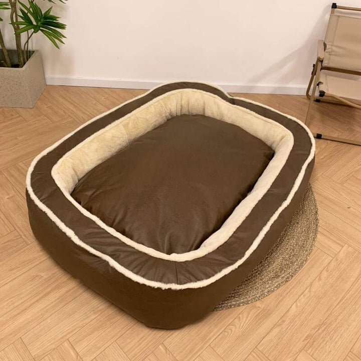 Elegant dark brown luxury dog bed in a living room, providing ultimate comfort & a stylish look for any pet.