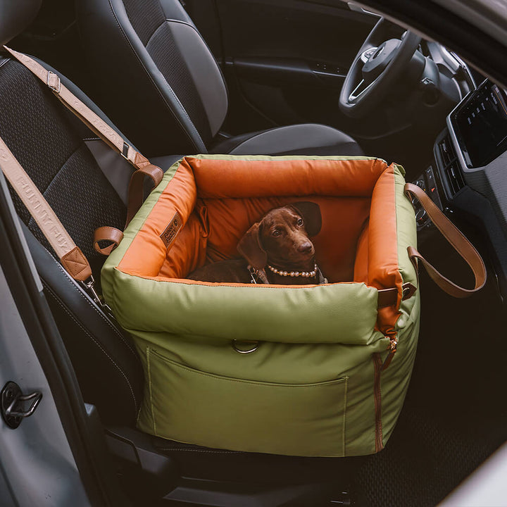Cozy faux leather dog travel seat, protects car interior from pet hair.