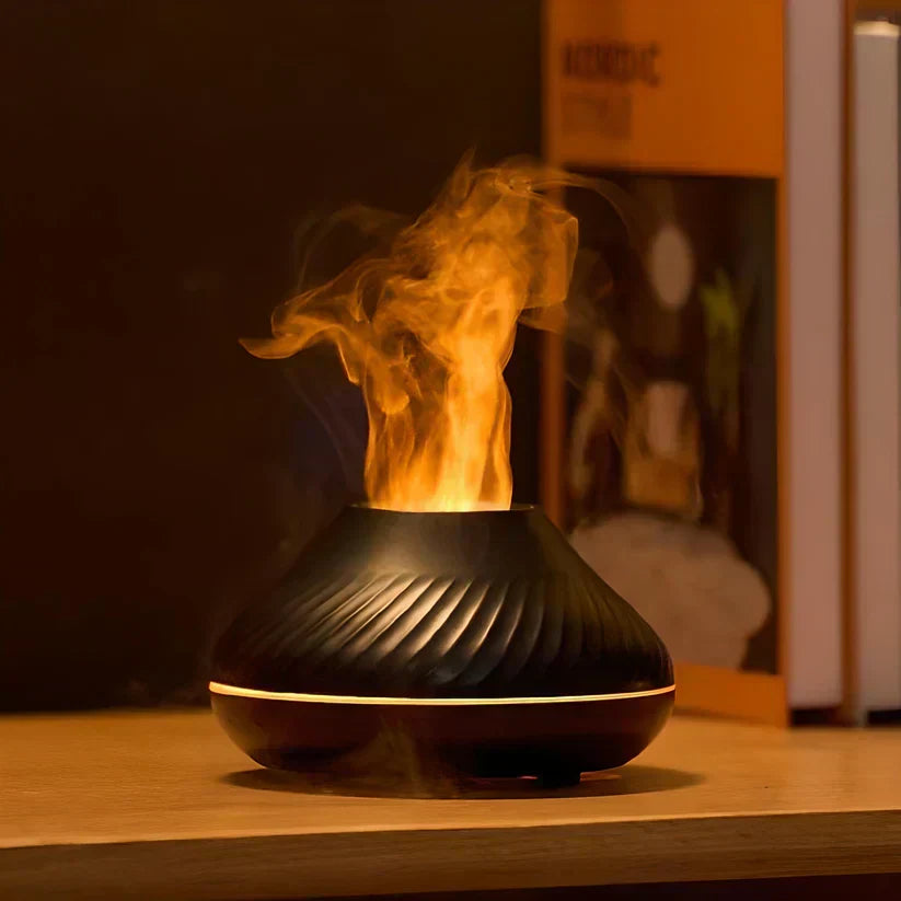 Stylish black LumoMist flame effect aroma diffuser. Humidifies & purifies air with essential oils for relaxation.