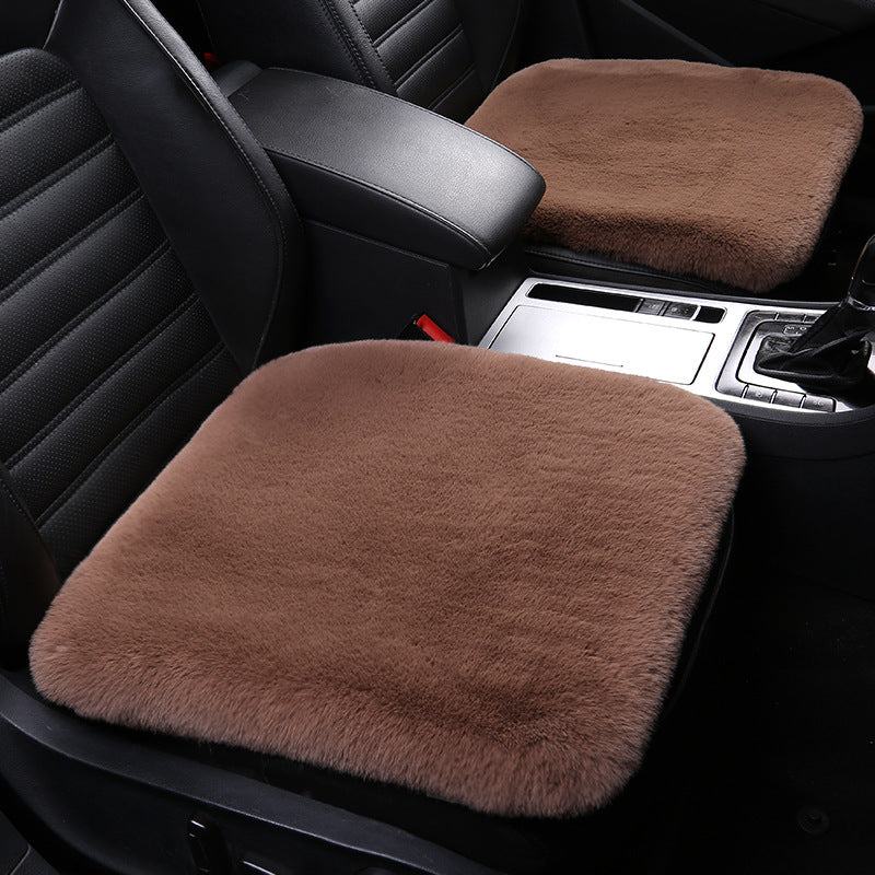 Versatile sheepskin cushion, perfect home decor or plush car seat protection. Natural wool.