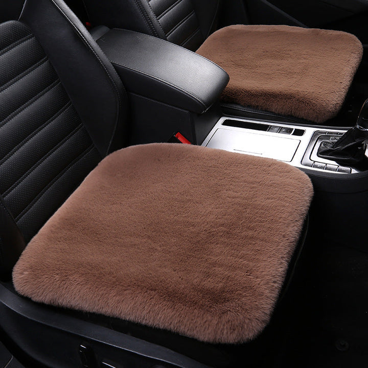 Versatile sheepskin cushion, perfect home decor or plush car seat protection. Natural wool.