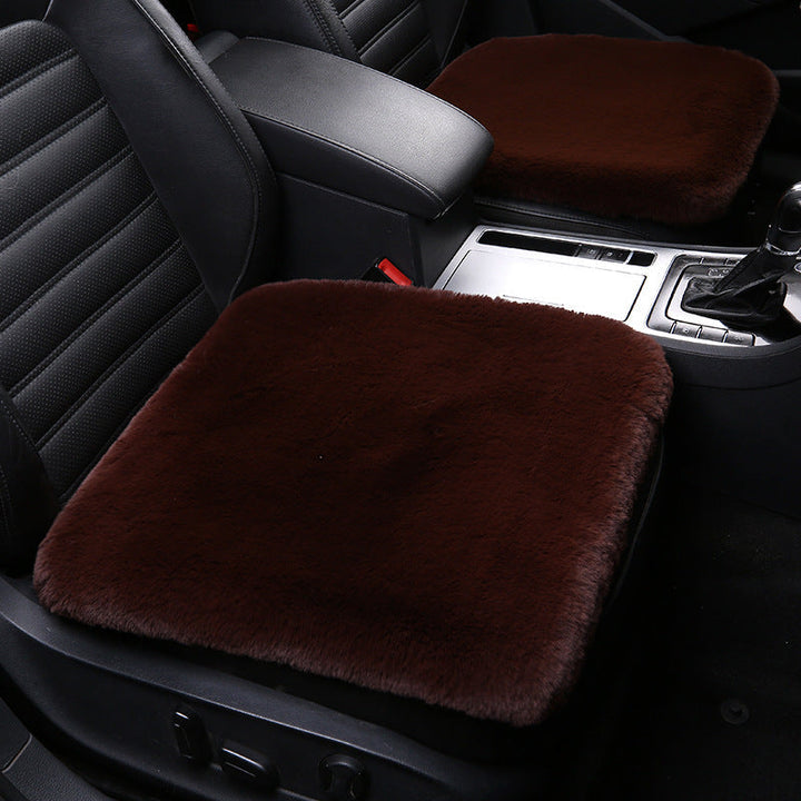 Stylish sheepskin cushion enhances home decor & offers cozy seat protection in your car.