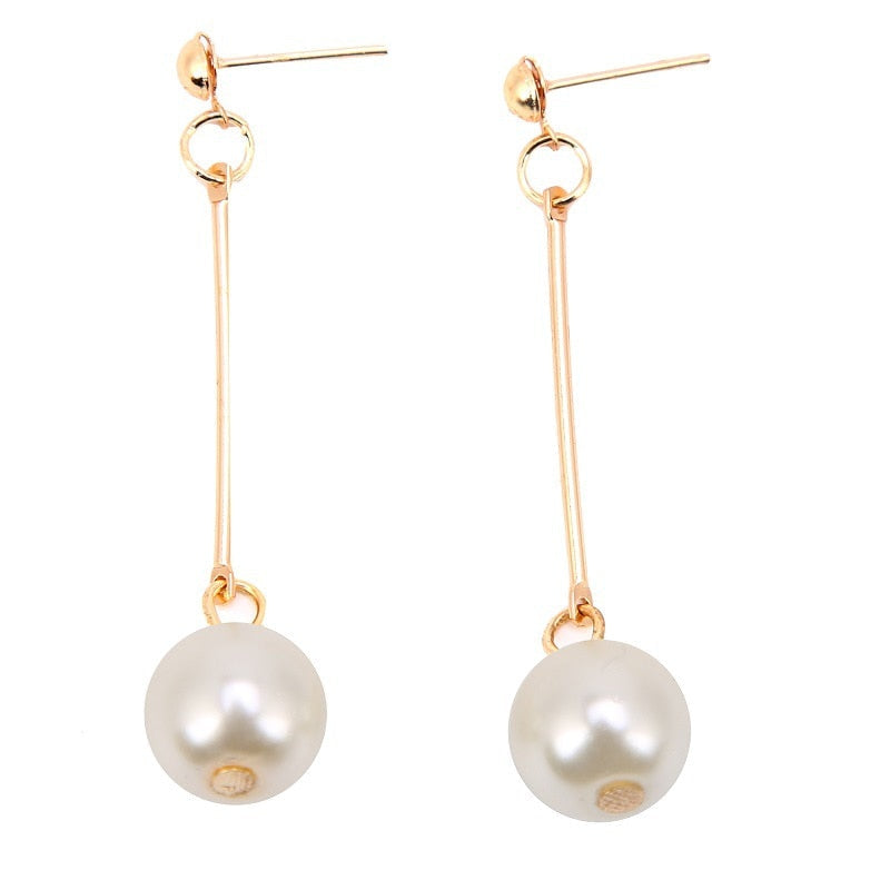 Chic women's fashion pearl drop earrings. Timeless luxury jewelry, an elegant gift for her, perfect for any occasion.