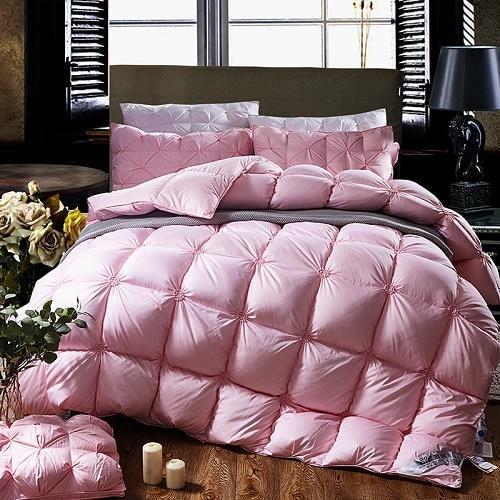 PlumeLux 100% goose down duvet on a bed, offering all-season comfort, luxury bedding & bedroom comfort.