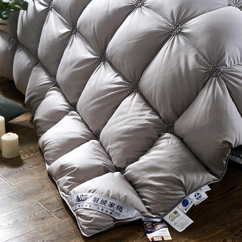 Quilted pattern detail on a white PlumeLux 100% goose down duvet, ensuring even warmth & comfort.